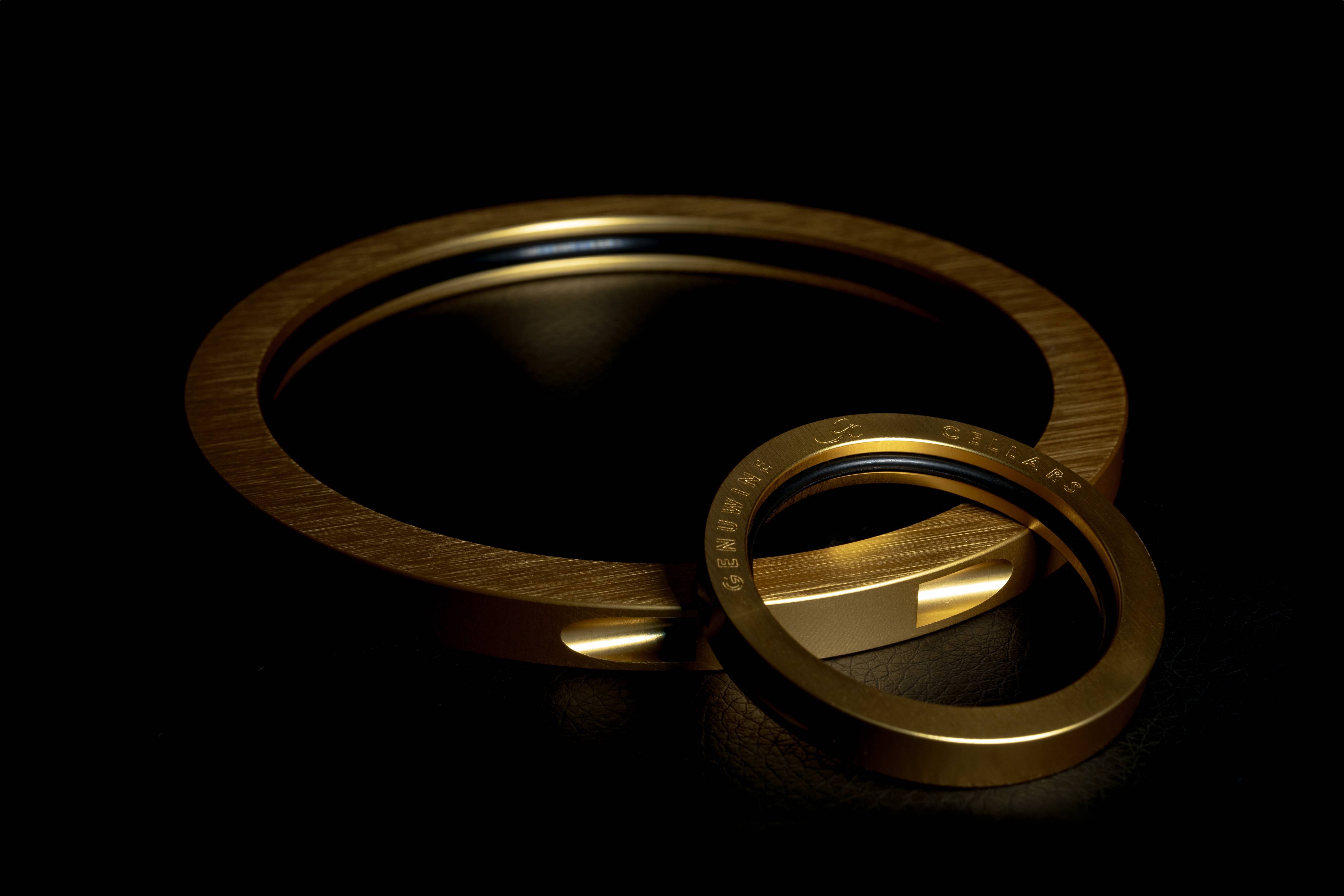 Golden ring cable wine racking system in a black background