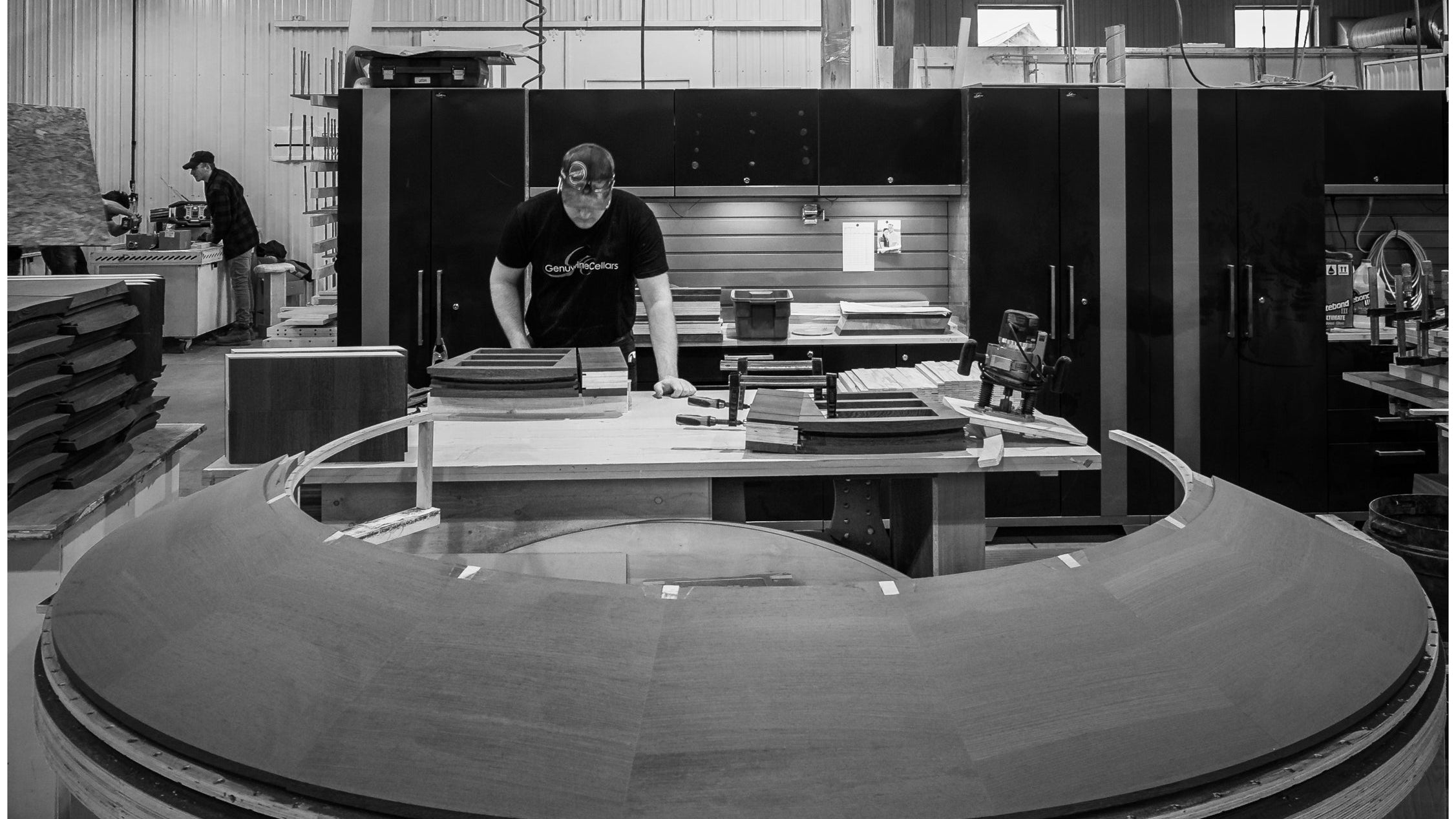 Person working in a large industrial setting with machinery and 'Finishing Department' sign.