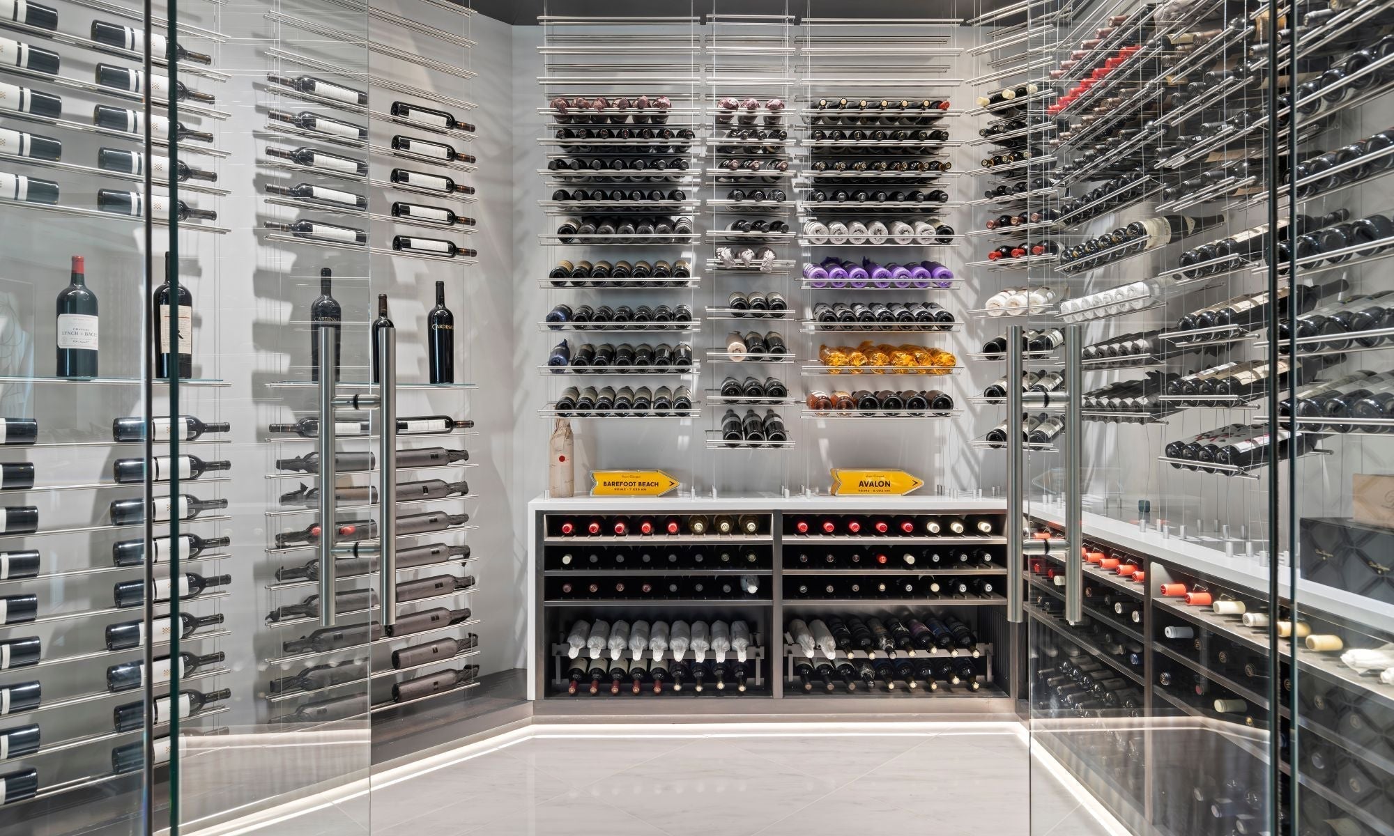 Modern glass wine cellar with luxury wine racks and organized bottle display