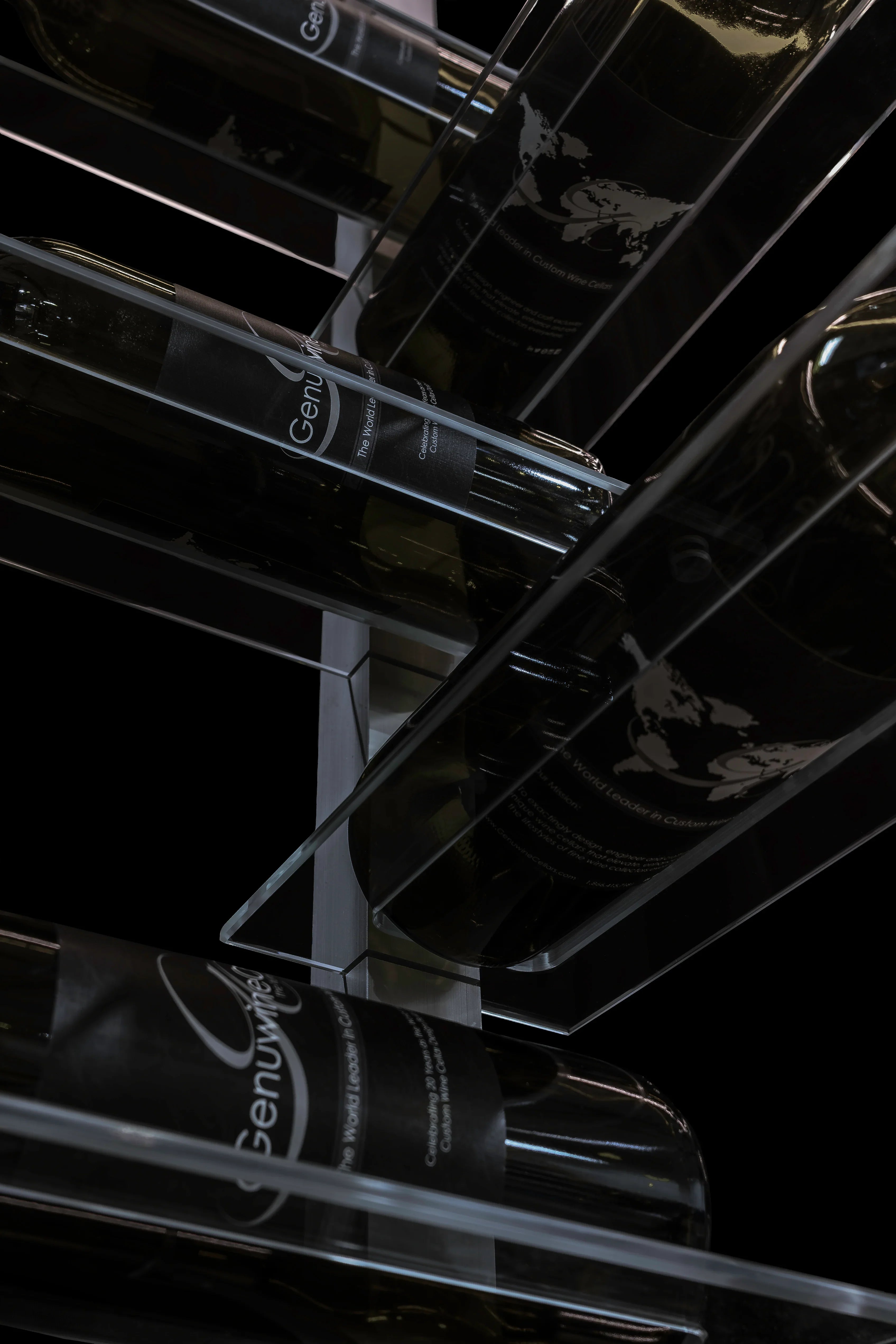 Set of clear acrylic shelves on a silver premium wine rack with a black background